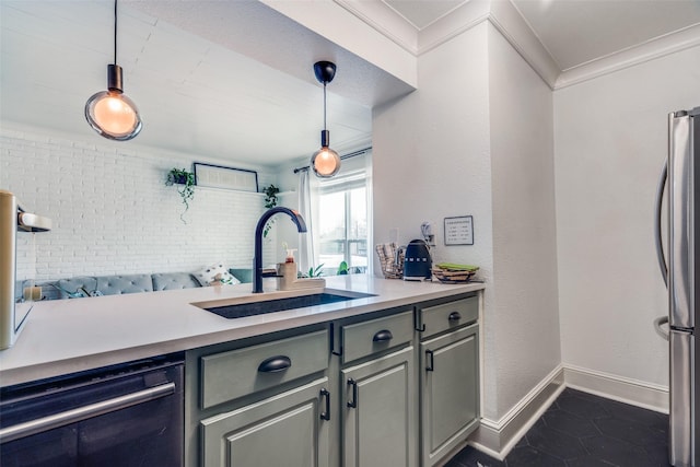 kitchen with sink, decorative light fixtures, ornamental molding, appliances with stainless steel finishes, and gray cabinets