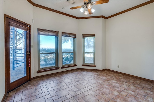 unfurnished room with ornamental molding, a wealth of natural light, and ceiling fan