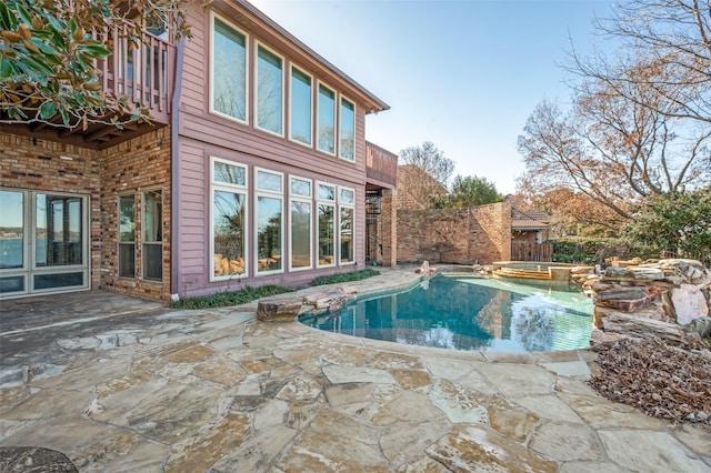 view of swimming pool featuring a patio