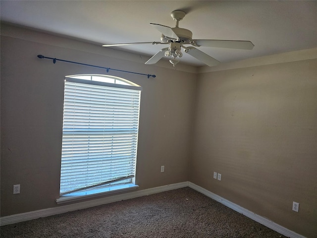 unfurnished room with ceiling fan, a healthy amount of sunlight, and carpet flooring