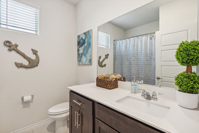 bathroom with vanity, toilet, and a shower with shower curtain