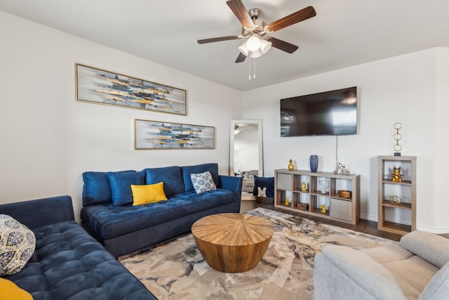 living room featuring hardwood / wood-style floors and ceiling fan