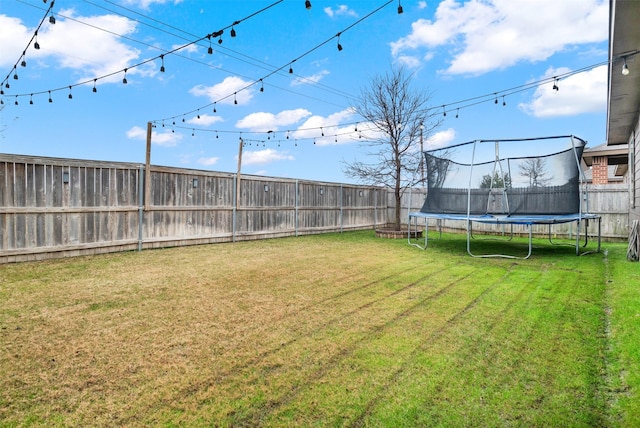 view of yard featuring a trampoline