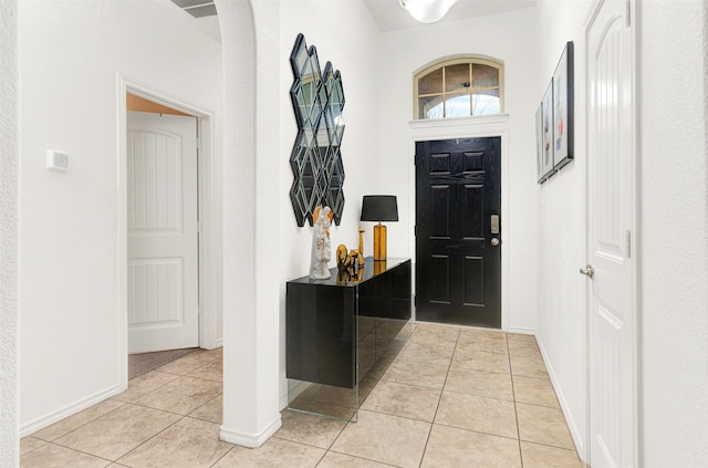 foyer entrance featuring light tile patterned floors