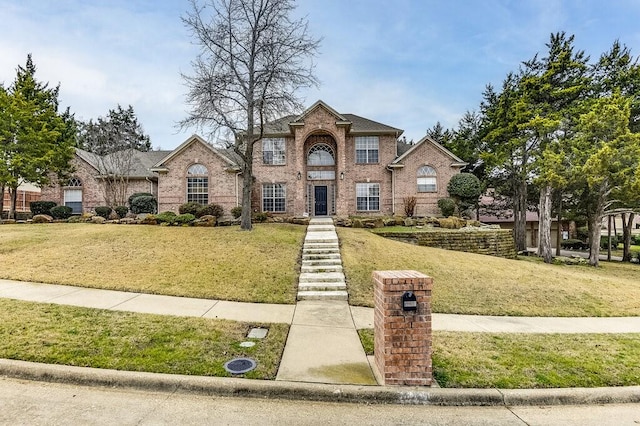 front facade with a front lawn