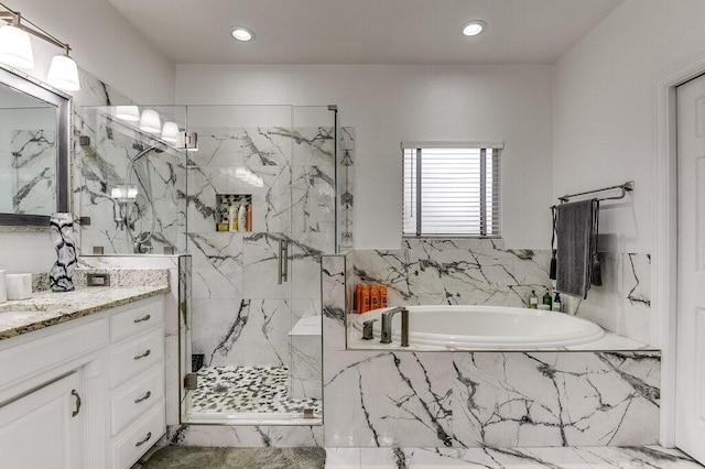 bathroom featuring vanity and plus walk in shower