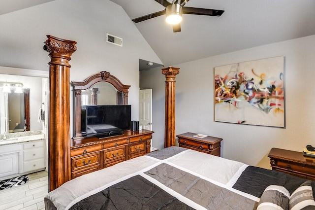 bedroom featuring lofted ceiling, connected bathroom, ceiling fan, and light hardwood / wood-style flooring