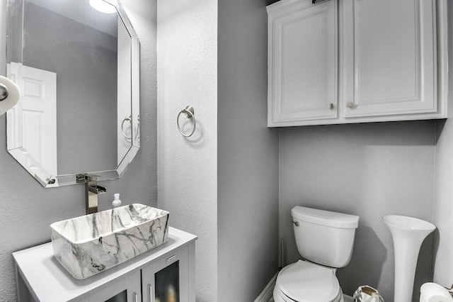 bathroom featuring sink and toilet