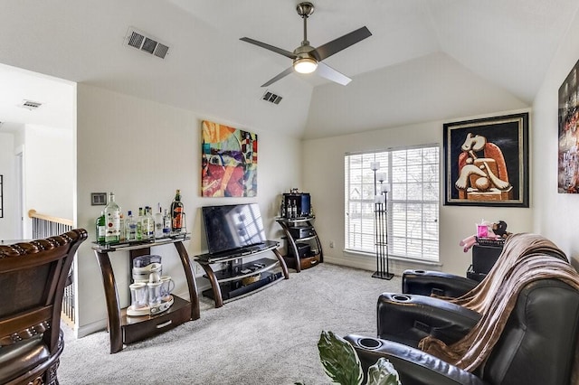 carpeted living room with vaulted ceiling and ceiling fan