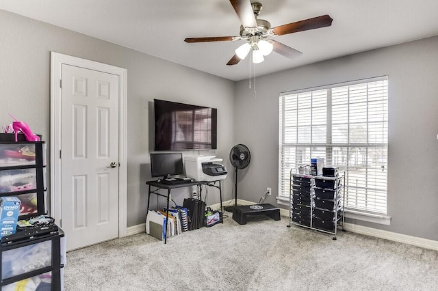 interior space featuring light colored carpet and ceiling fan