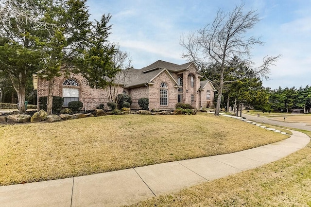 view of front of home with a front lawn