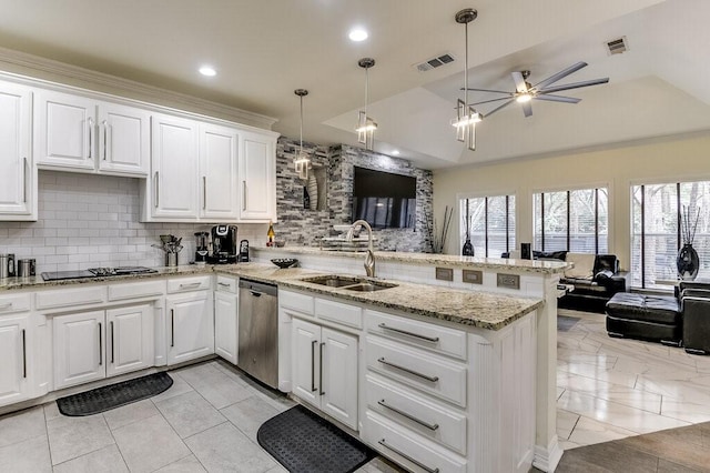 kitchen featuring decorative light fixtures, white cabinetry, sink, stainless steel dishwasher, and kitchen peninsula