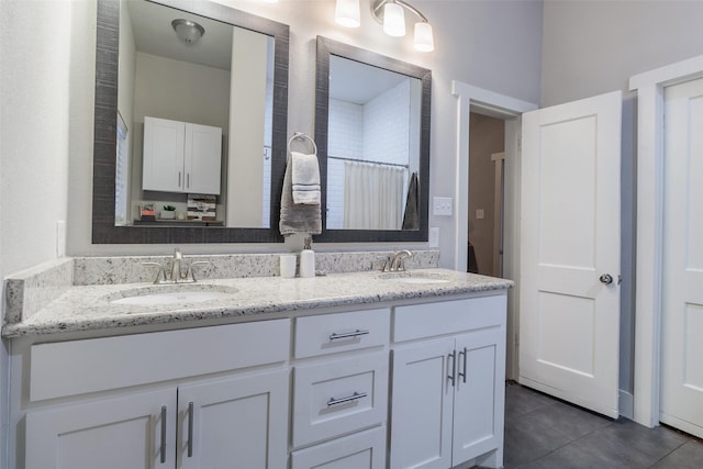 bathroom with tile patterned flooring, vanity, and a shower with shower curtain