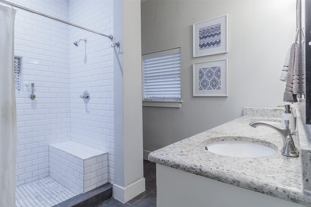 bathroom featuring vanity, curtained shower, and tile patterned floors