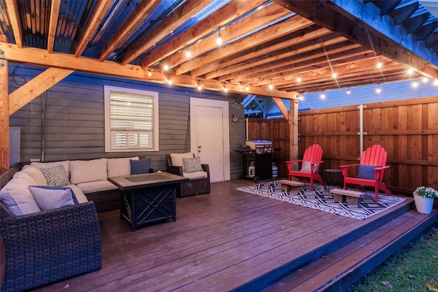 wooden deck with a grill and an outdoor living space with a fire pit