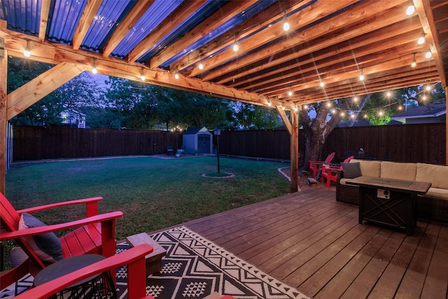 wooden deck with a storage unit, outdoor lounge area, and a yard