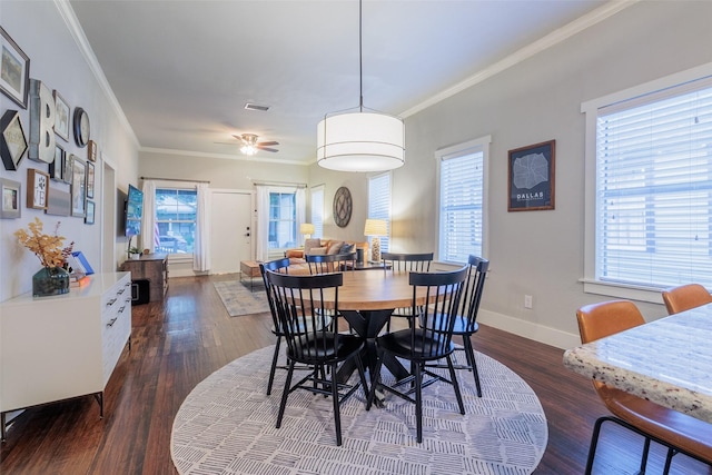 dining area with crown molding, dark hardwood / wood-style floors, and ceiling fan