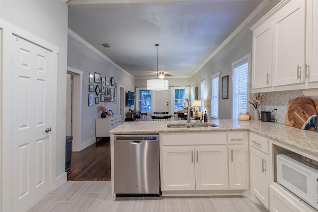 kitchen with white cabinetry, sink, stainless steel dishwasher, and kitchen peninsula