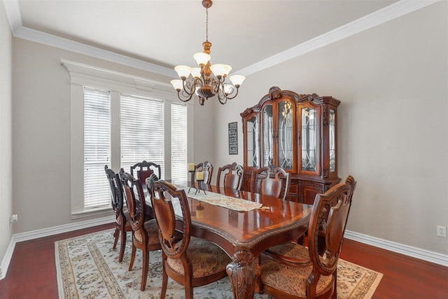 dining area with crown molding, dark hardwood / wood-style floors, and a notable chandelier