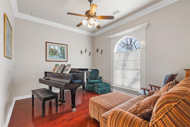 sitting room featuring ornamental molding, dark hardwood / wood-style floors, and ceiling fan