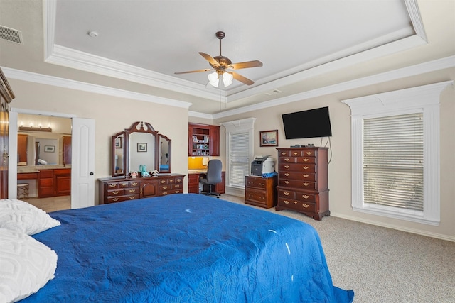 bedroom featuring light carpet, a tray ceiling, and ornamental molding