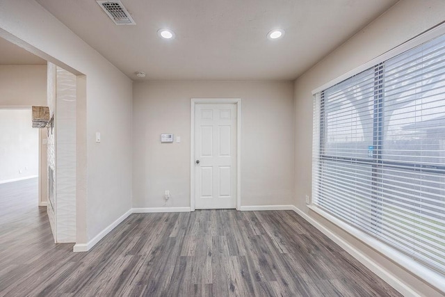 spare room featuring dark hardwood / wood-style floors