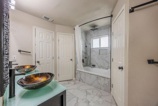 bathroom featuring shower / bath combination with curtain and vanity