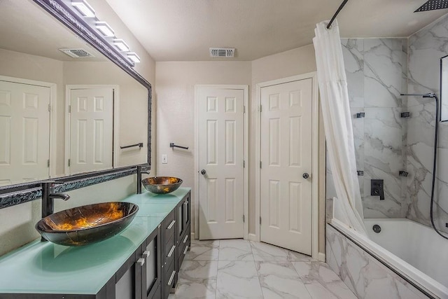 bathroom with vanity and shower / bath combo