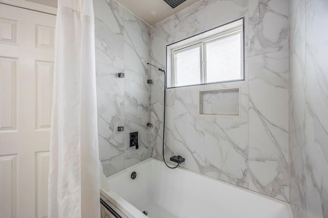 bathroom with shower / tub combo with curtain