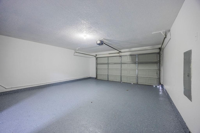 garage featuring a garage door opener and electric panel