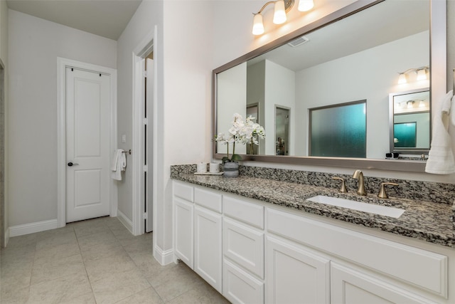 bathroom with vanity and tile patterned floors