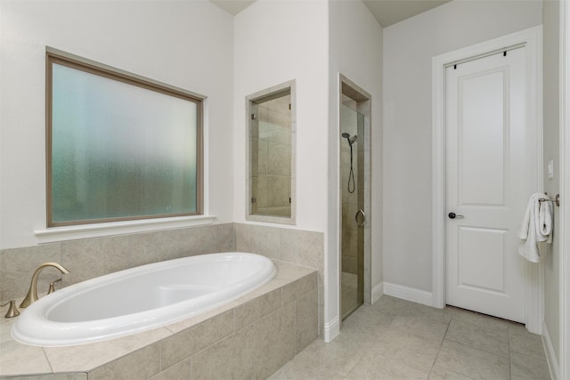 bathroom with tile patterned flooring and plus walk in shower