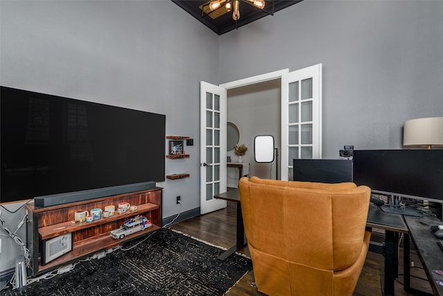 home office featuring dark wood-type flooring and french doors