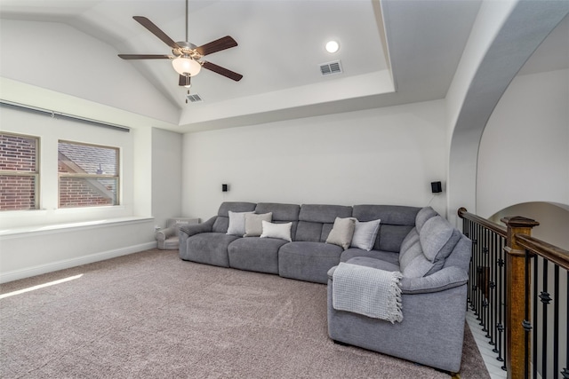 living room featuring lofted ceiling, ceiling fan, and carpet flooring