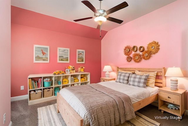 carpeted bedroom with vaulted ceiling and ceiling fan