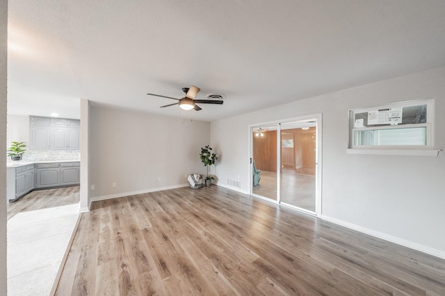 interior space featuring light hardwood / wood-style floors and ceiling fan