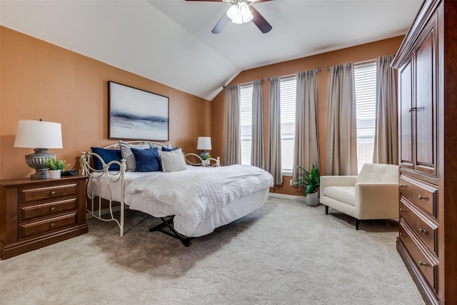 bedroom with light carpet, lofted ceiling, and ceiling fan