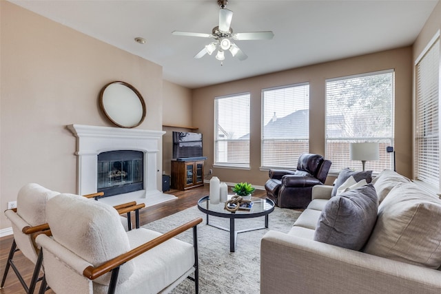 living room featuring ceiling fan and light wood-type flooring