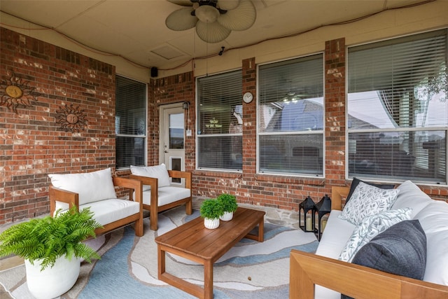 view of patio / terrace with an outdoor living space and ceiling fan