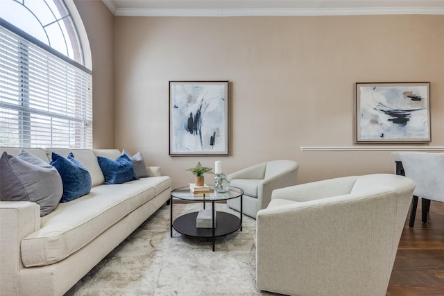 living room featuring crown molding, parquet floors, and a wealth of natural light