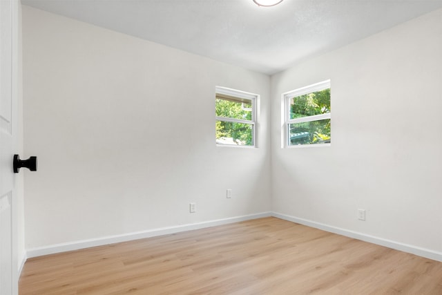 unfurnished room featuring light wood-type flooring