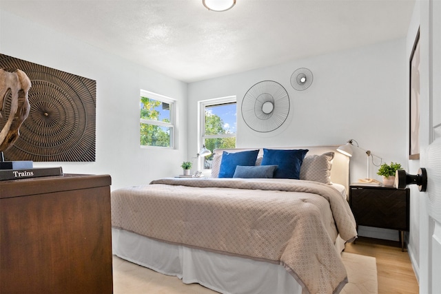 bedroom with light wood-type flooring