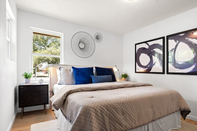 bedroom with light wood-type flooring