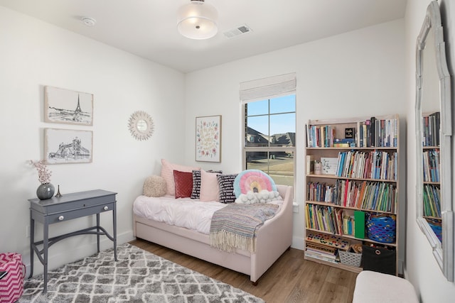 sitting room with hardwood / wood-style flooring