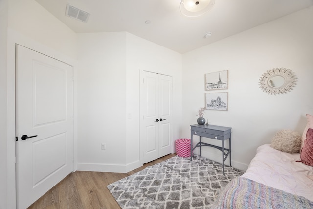 bedroom featuring a closet and light wood-type flooring