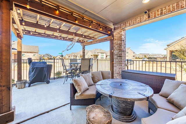 view of patio / terrace featuring area for grilling, outdoor lounge area, and a pergola