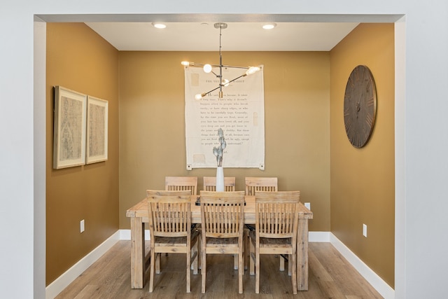 dining room featuring a chandelier and hardwood / wood-style floors