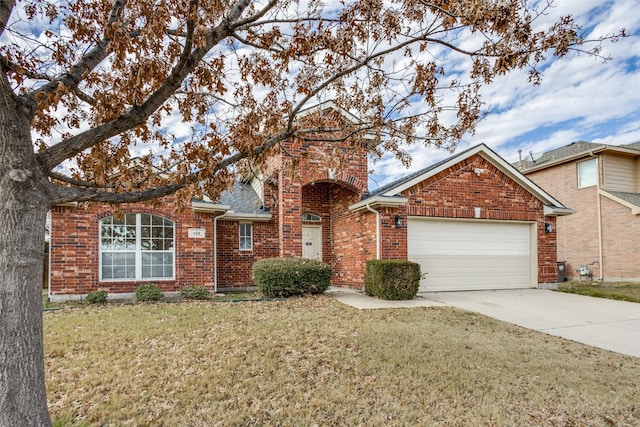 front facade with a garage and a front yard