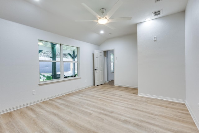 unfurnished room featuring light hardwood / wood-style flooring, ceiling fan, and vaulted ceiling