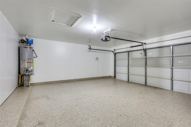 garage with a garage door opener and gas water heater